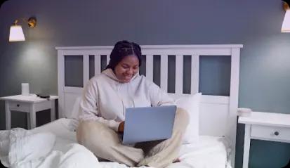 Picture of a student at home with a laptop