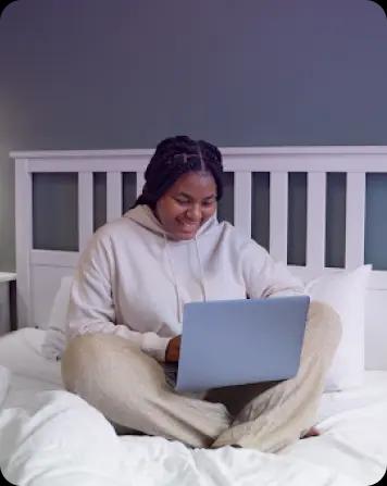 Picture of a student at home with a laptop